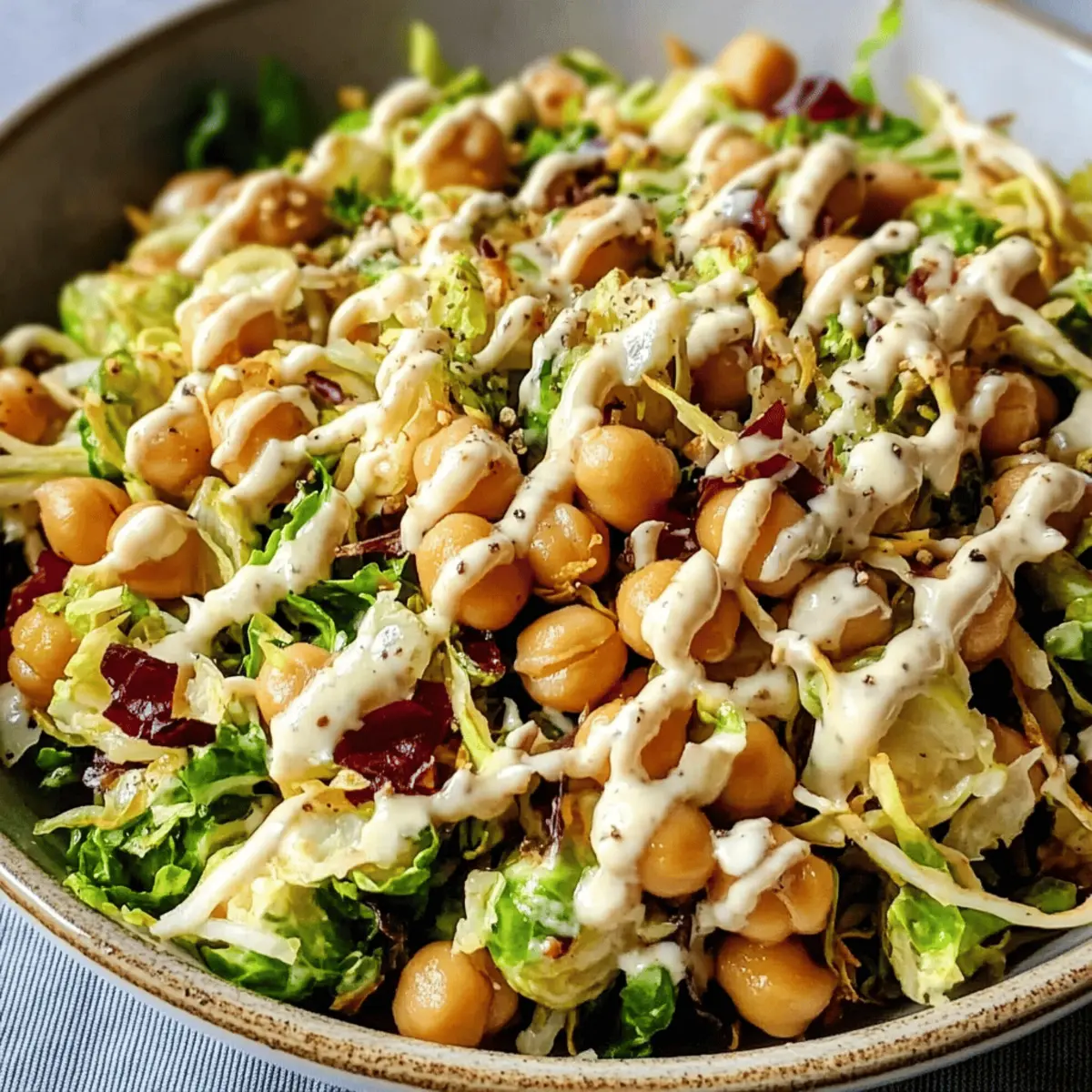 Shaved Brussels Sprouts Salad with Chickpeas and Lemon Tahini Dressing